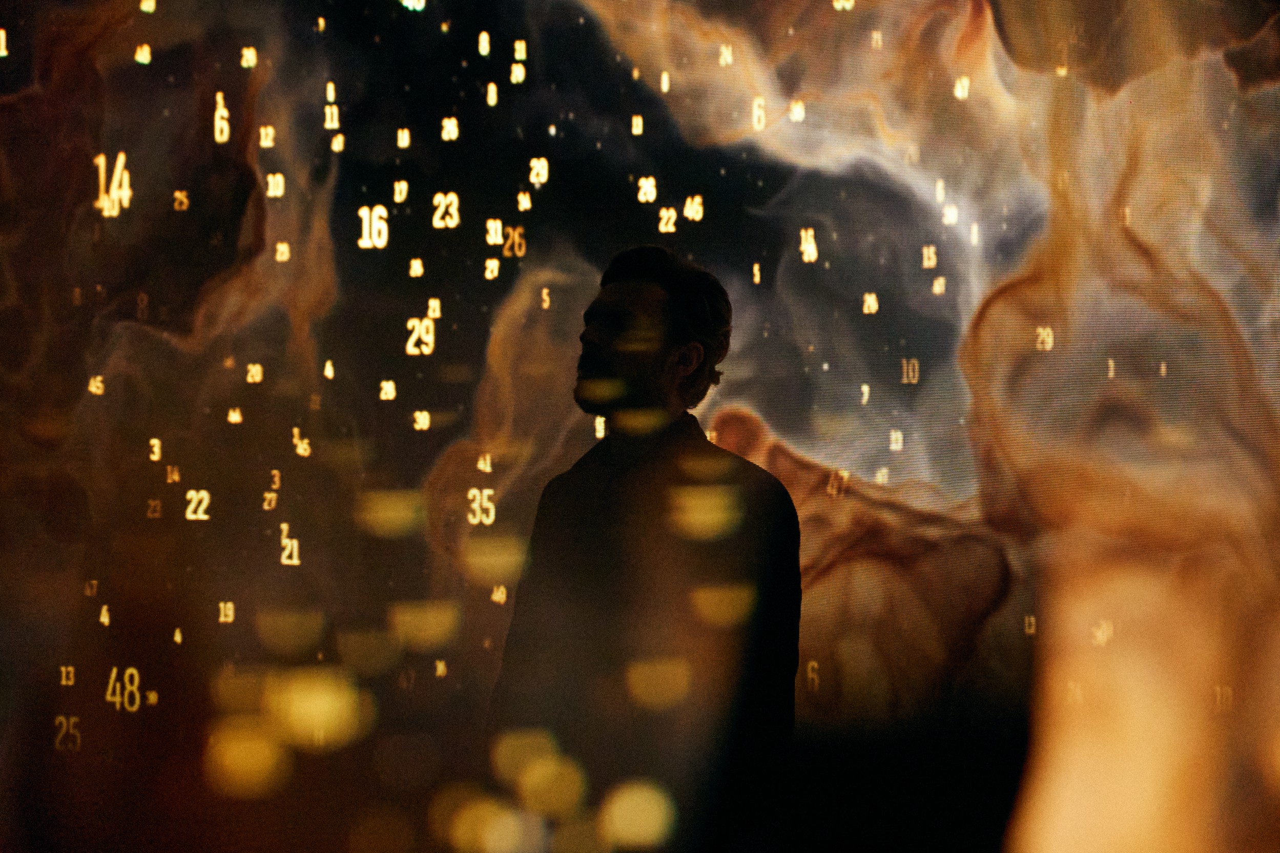 Actor silhouette against the number nebula