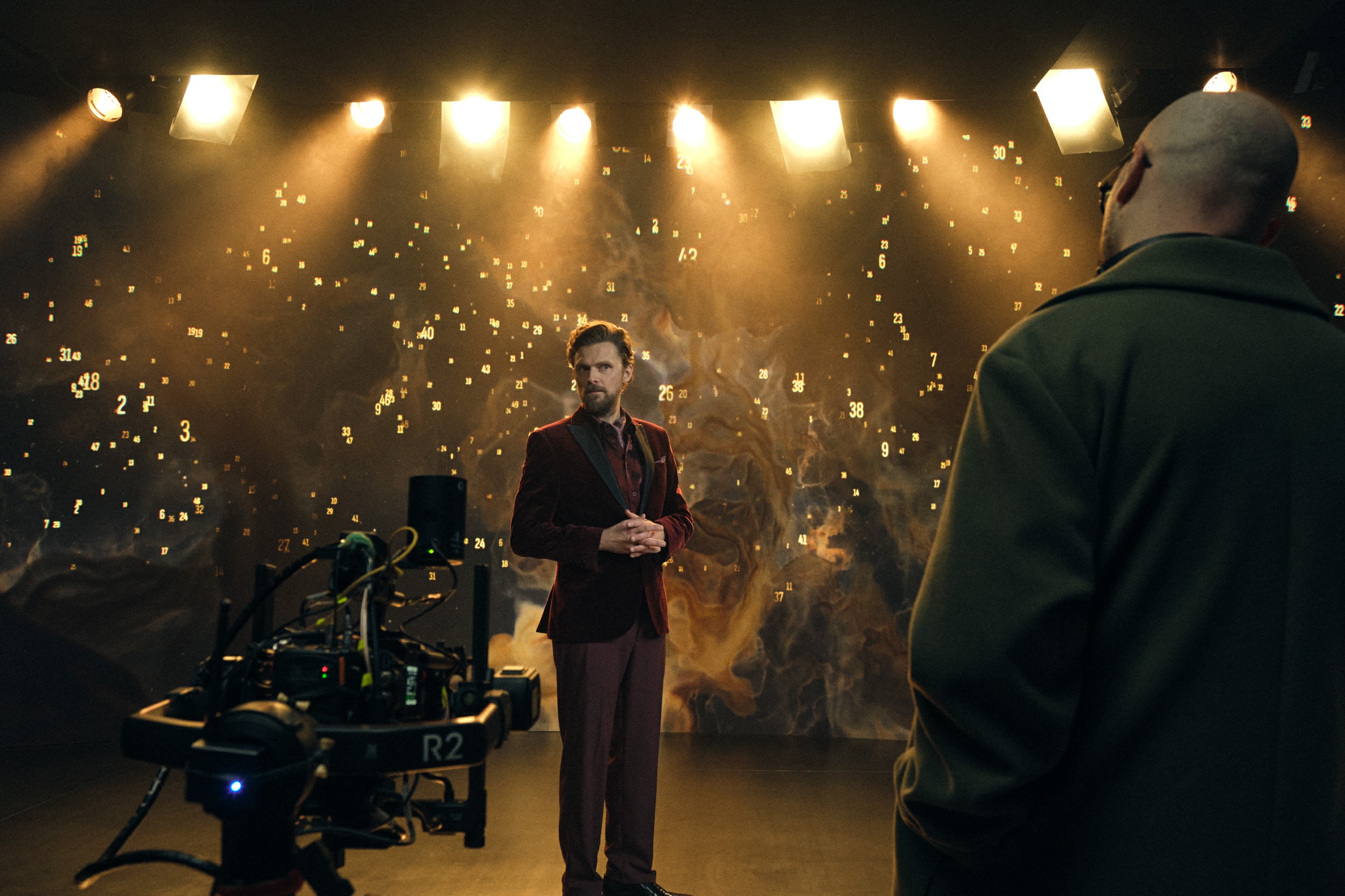 Wide on-set shot with camera rig and actor
